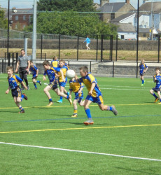 An image of a football pitch we constructed with a children's football team playing on it